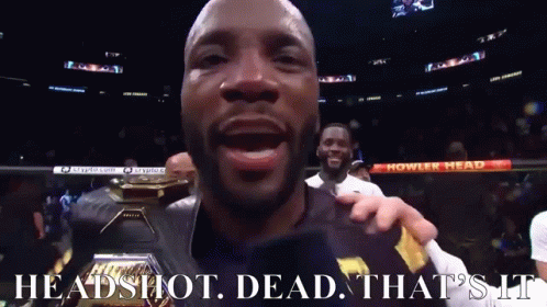 A Man In A Boxing Ring With The Words Headshot Dead That 'S It On The Bottom GIF