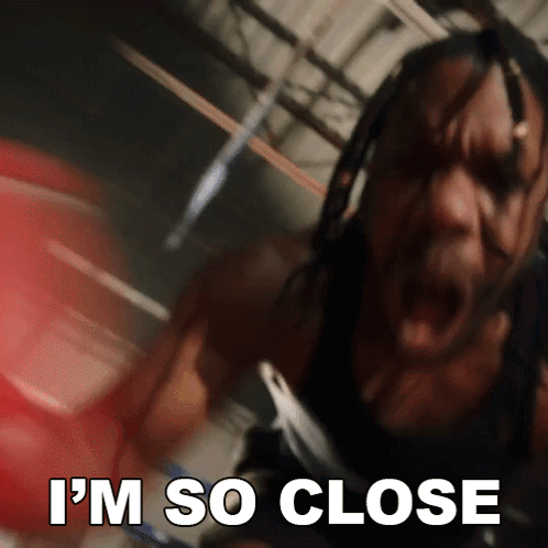 A Man In A Boxing Ring With The Words " I 'M So Close " Above Him GIF