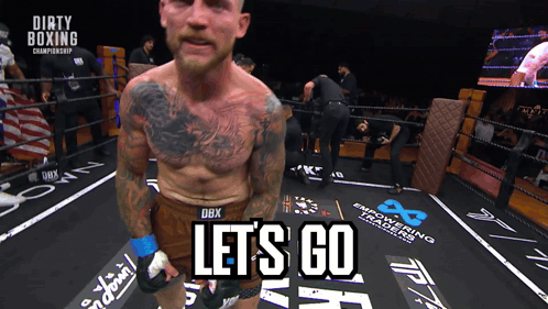 A Man In A Boxing Ring With The Words Let 'S Go Written On The Floor GIF