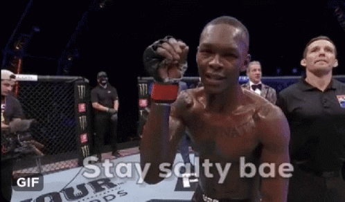 A Man In A Boxing Ring With The Words " Stay Salty Bae " On The Bottom GIF
