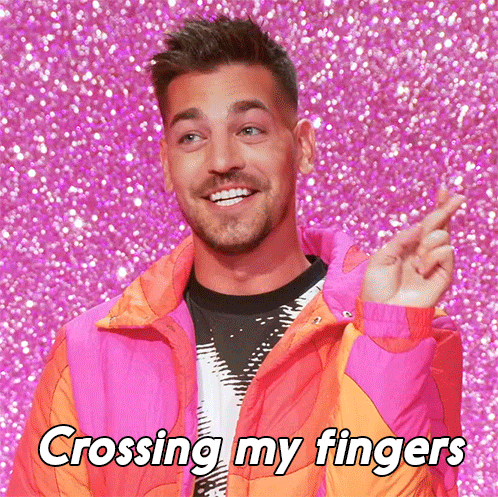 Man In Pink Jacket Crossing Fingers GIF
