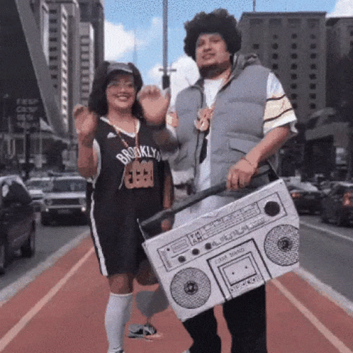 A Man In A Brooklyn Jersey Holds A Boom Box GIF