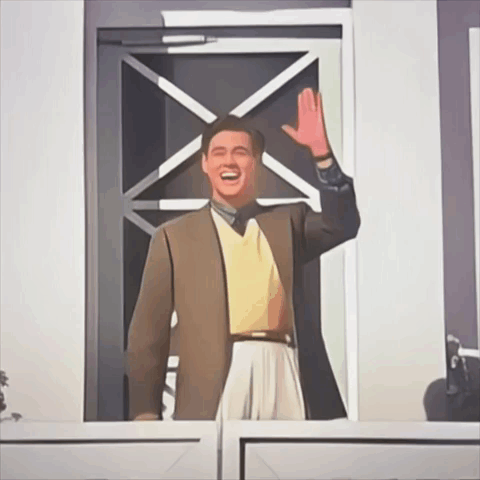 A Man In A Brown Jacket And Yellow Sweater Waving His Hand GIF