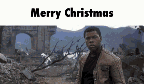 A Man In A Brown Jacket Stands In Front Of A Ruined Building With The Words Merry Christmas Written Above Him GIF