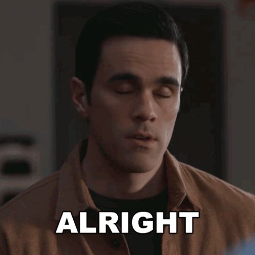 Man In Brown Shirt Saying Alright GIF