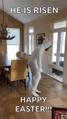 A Man In A Bunny Suit Is Dancing In A Living Room . GIF