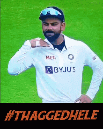 A Man In A Byju 'S Shirt Is Standing On A Field GIF