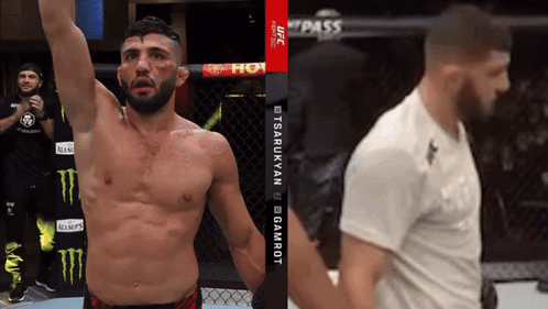 A Man In A Cage With A Monster Energy Logo On The Wall GIF