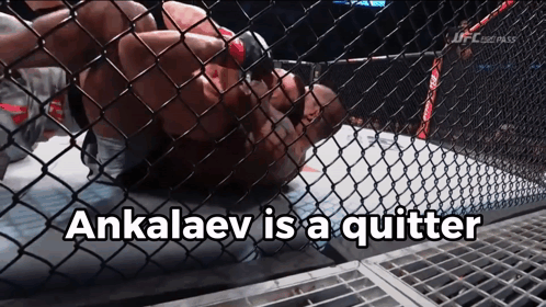 A Man In A Cage With The Words " Ankalaev Is A Quitter " On The Bottom GIF