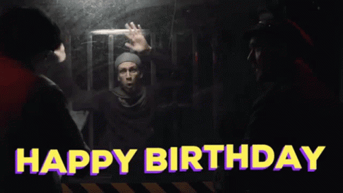 A Man In A Cage With The Words Happy Birthday Above Him GIF