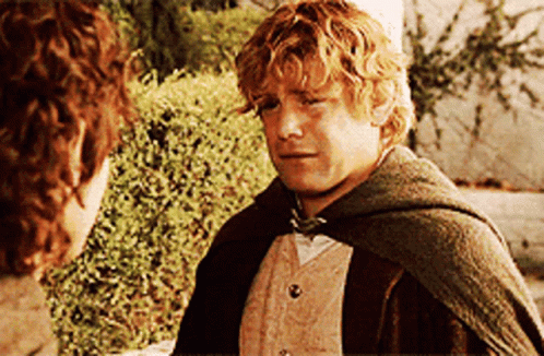 A Man In A Cape Talks To Another Man GIF
