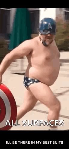 A Man In A Captain America Costume Is Holding A Shield And A Ball . GIF