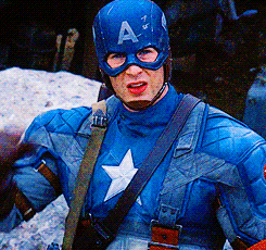 A Man In A Captain America Costume Is Wearing A Helmet With The Letter A On It GIF