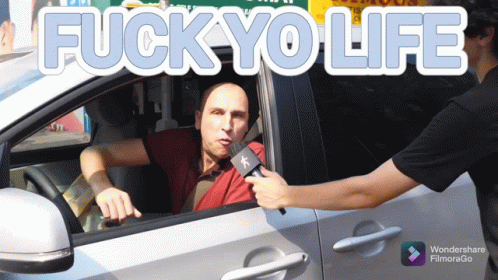 A Man In A Car Is Being Interviewed By Another Man With The Words Fuck Yo Life Above Him GIF