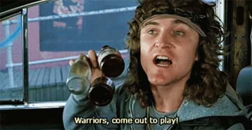 a man in a car is holding two bottles of beer and saying warriors come out to play