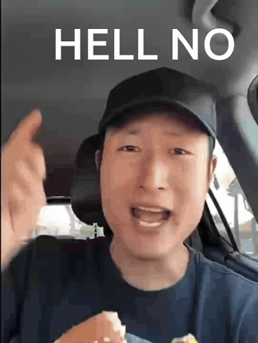 a man in a car says hell no while holding a hamburger