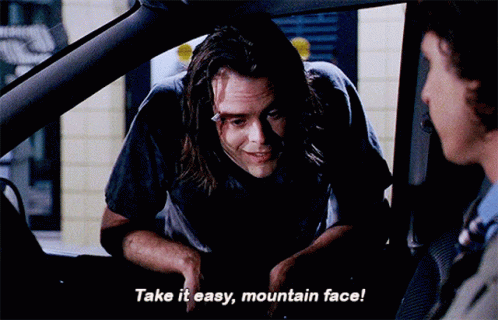 a man in a car talking to another man and says take it easy mountain face