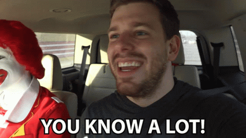 A Man In A Car With A Mcdonald 'S Clown Behind Him And The Words You Know A Lot GIF