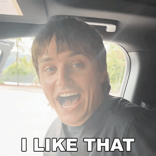 A Man In A Car With His Mouth Open And The Words I Like That Below Him GIF