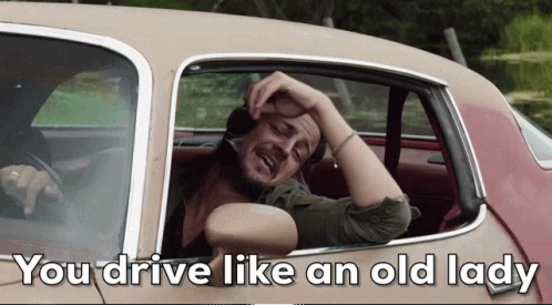 A Man In A Car With The Words You Drive Like An Old Lady GIF