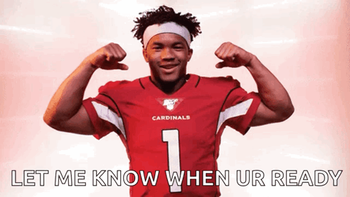 A Man In A Cardinals Jersey Flexing His Muscles GIF