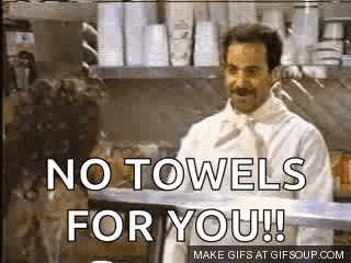 A Man In A Chef 'S Coat Is Standing In A Kitchen And Says `` No Towels For You ! `` GIF