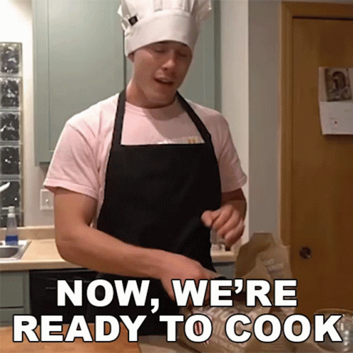 A Man In A Chef 'S Hat And Apron Is Saying Now We 'Re Ready To Cook GIF