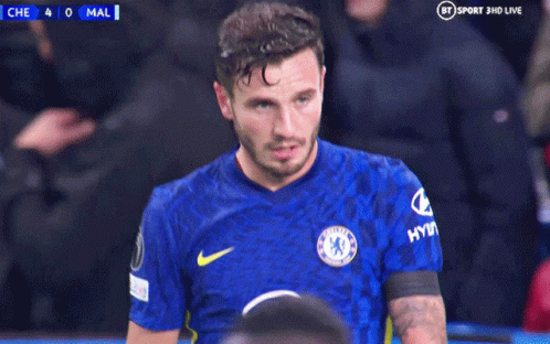 A Man In A Chelsea Jersey Holds His Head In His Hands GIF