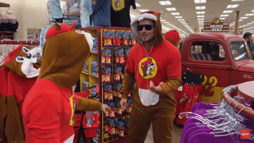 A Man In A Chipmunk Costume Stands In Front Of A Sign That Says " Order Here " GIF