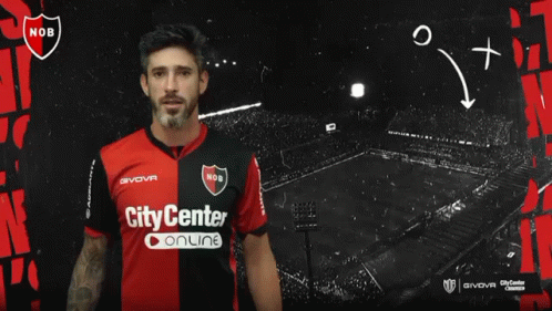 A Man In A City Center Online Jersey Stands In Front Of A Black Background GIF