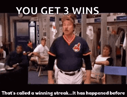 A Man In A Cleveland Indians Jersey Is Standing In A Locker Room GIF