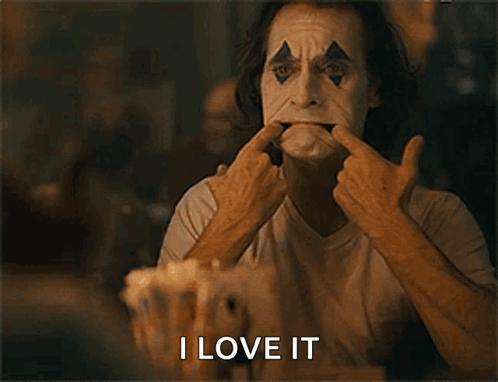A Man In A Clown Mask Is Making A Funny Face And The Words I Love It Are Below Him GIF