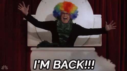 A Man In A Clown Wig Is Sitting In A Toilet With His Arms Outstretched And The Words I 'M Back GIF