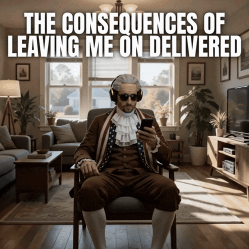 A Man In A Colonial Costume Is Sitting In A Chair Looking At His Phone GIF