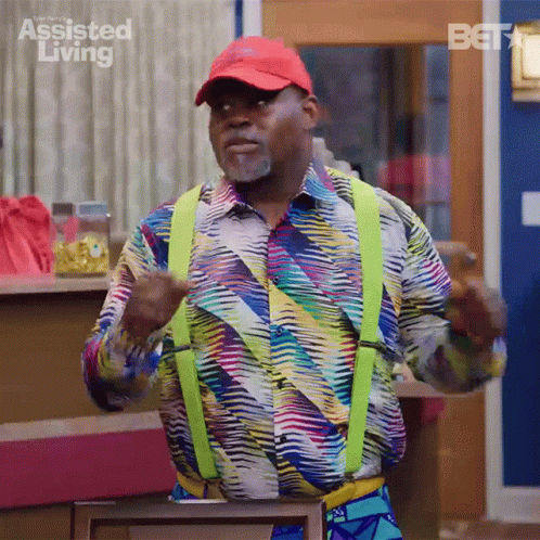 Man In Colorful Shirt And Yellow Suspenders Dancing GIF