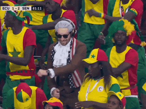 A Man In A Costume Is Dancing In A Crowd With Ecu 1-2 Sen Written On The Screen GIF