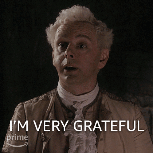 a man in a costume says i 'm very grateful on a screen