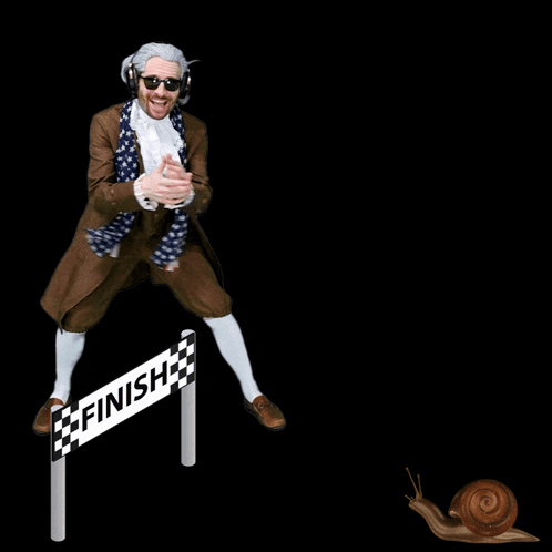 A Man In A Costume Stands In Front Of A Finish Line Sign GIF