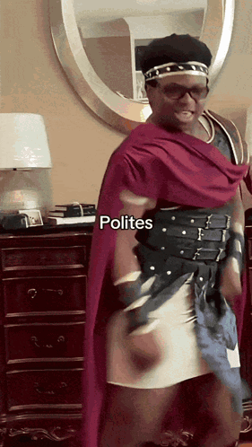 A Man In A Costume With Polites Written On The Bottom Right GIF