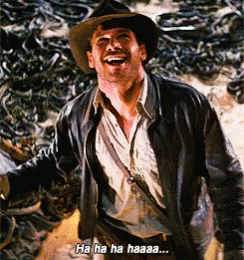 A Man In A Cowboy Hat And Leather Jacket Is Laughing And Says Ha Ha Haaaa GIF