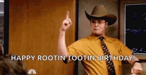 A Man In A Cowboy Hat And Tie Is Pointing Up . GIF