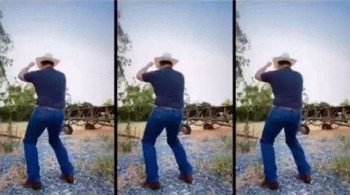 A Man In A Cowboy Hat Is Dancing In A Dirt Field GIF