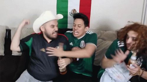 A Man In A Cowboy Hat Is Holding A Beer GIF