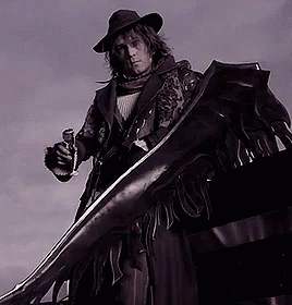 A Man In A Cowboy Hat Is Holding A Gun And A Large Sword GIF