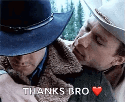 A Man In A Cowboy Hat Is Hugging Another Man In A Cowboy Hat . GIF
