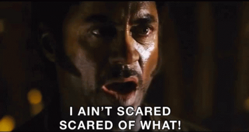 A Man In A Cowboy Hat Is Saying I Ain 'T Scared Scared Of What GIF