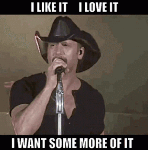 A Man In A Cowboy Hat Is Singing Into A Microphone With The Caption I Like It I Love It GIF