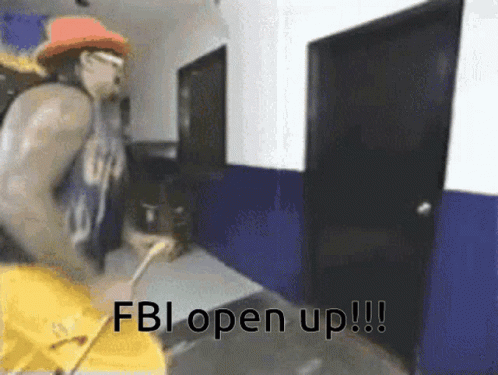 A Man In A Cowboy Hat Is Standing In A Hallway With The Words Fbi Open Up Written On It . GIF