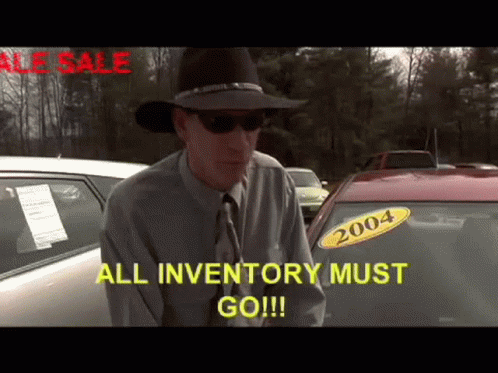 A Man In A Cowboy Hat Is Standing In Front Of A Car With A 2004 Sticker On It GIF