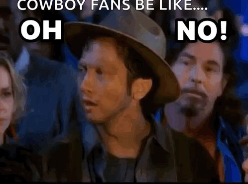 A Man In A Cowboy Hat Is Standing In Front Of A Crowd Of People And Says Oh No . GIF